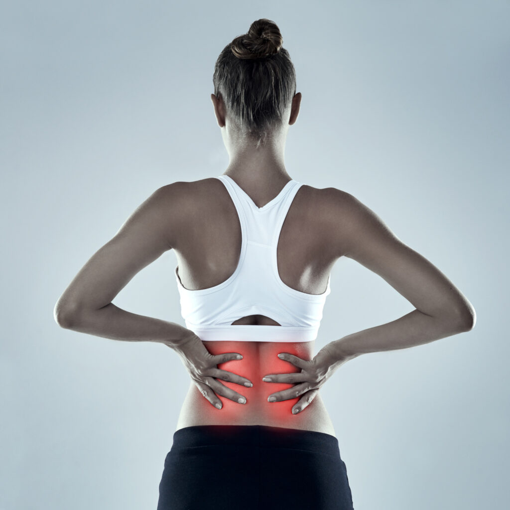 exercise injury back pain woman red glow spine x ray bone isolated grey background fitness athlete anatomy overlay with inflammation muscle tendon tension studio